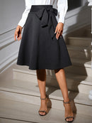 Women's Elegant High Waist Flared Midi Skirt with Bow Belt, Inclusive Fit, Stretch Knit Fabric, Versatile for Office and Party W